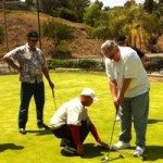 Gary gets a lesson from Golf Pro, Jay Kim.